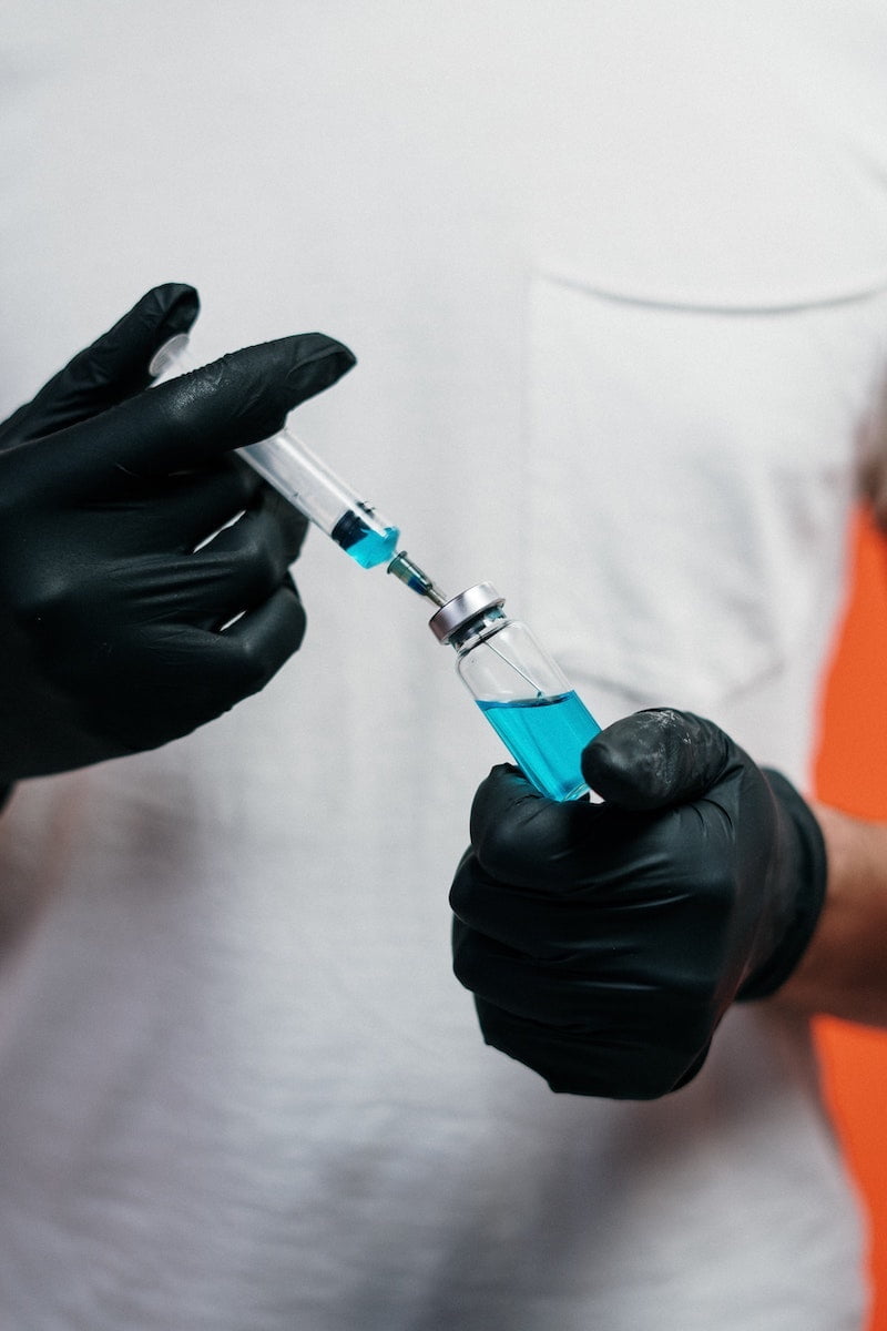 Person holding a vaccine, COVID-19