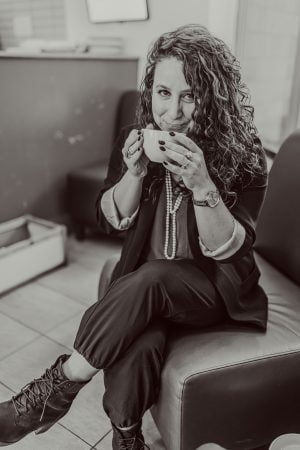 Blair Kaplan Venables sitting and holding her mug