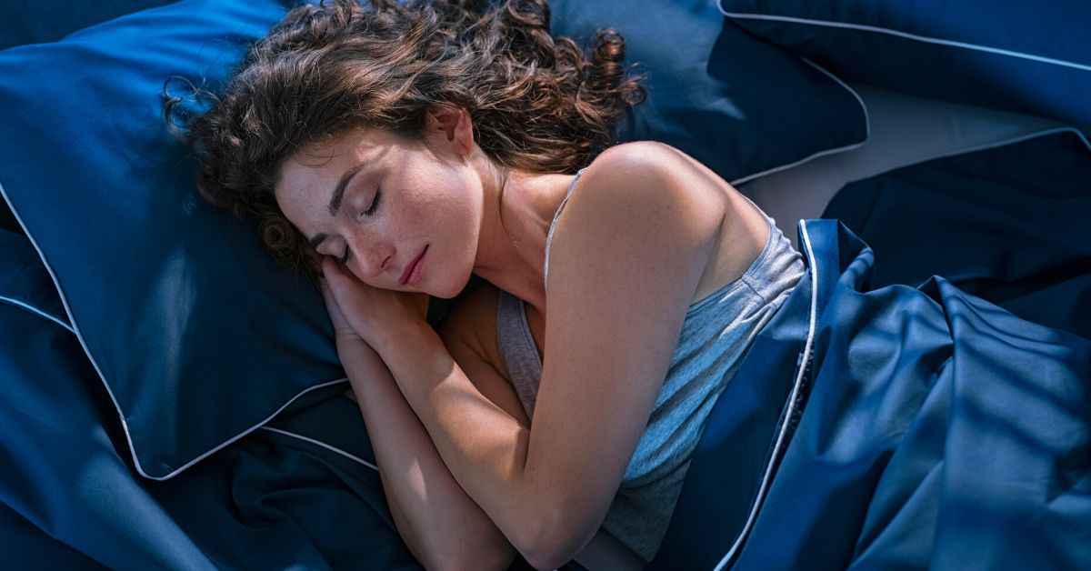 Woman Sleeping on Blue Bed